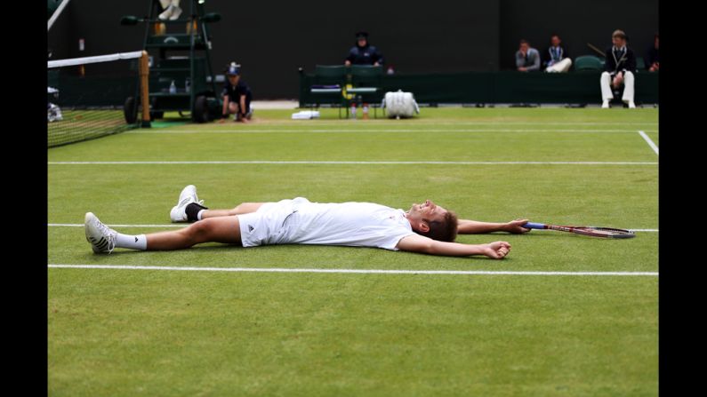 Florian Mayer of Germany celebrates match point during his men's singles fourth round match against Richard Gasquet of France on Day Eight of the Wimbledon Lawn Tennis Championships in London on Tuesday. The grand slam event runs through July 8. 