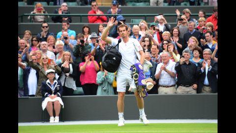 Britain's Andy Murray waves to the crowd after his fourth round men's singles victory over Croatia's Marin Cilic on Day Eight of the 2012 Wimbledon Championships tennis tournament.