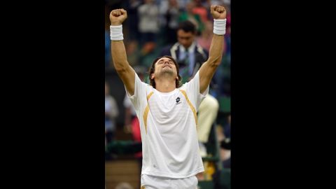 Spain's David Ferrer celebrates after his fourth round men's singles victory over Argentina's Juan Martin Del Potro on Day Eight of Wimbledon.