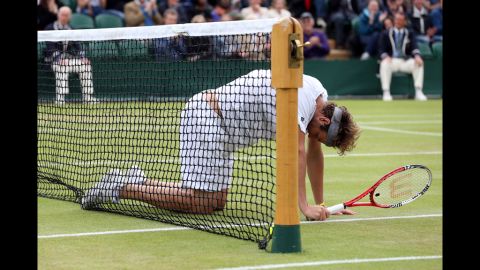 Fish falls to the ground during his fourth round match against Tsonga.