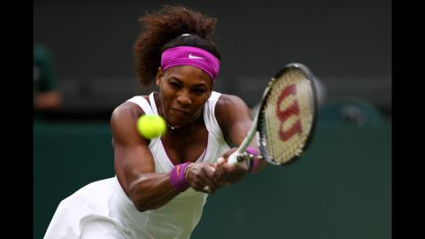 American Serena Williams returns a shot during her Ladies' Singles quarterfinal match against Petra Kvitova of the Czech Republic.
