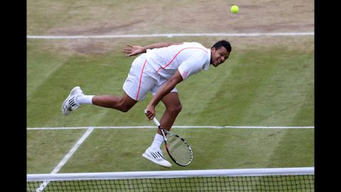 Jo-Wilfried Tsonga of France returns a shot during his Gentlemen's Singles fourth round match against  American Mardy Fish.