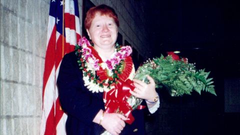 Jutka Emoke Barabas smiles for the camera at her naturalization ceremony in Honolulu in 2000.