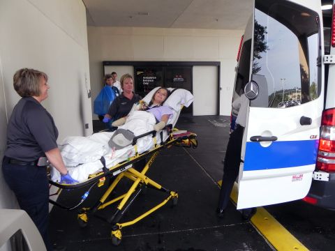 After two months in the hospital, Aimee Copeland is transferred into an ambulance outside Doctors Hospital in Augusta, Georgia, on Monday to continue her recovery from a flesh-eating bacteria at a rehab facility on July 2. She stayed in a rehab center before returning home.