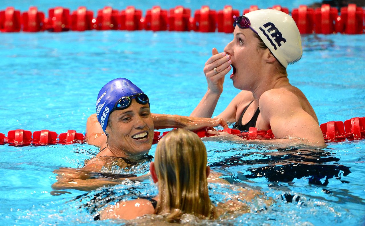 After her fourth-place finish in the women's 50-meter freestyle final, Dara Torres, center, turns to winner Jessica Hardy on the last day of the 2012 U.S. Olympic Swimming Team Trials in Omaha, Nebraska, on Monday. Kara Lynn Joyce, top, reacts to finishing second, which secures her slot to compete in London.