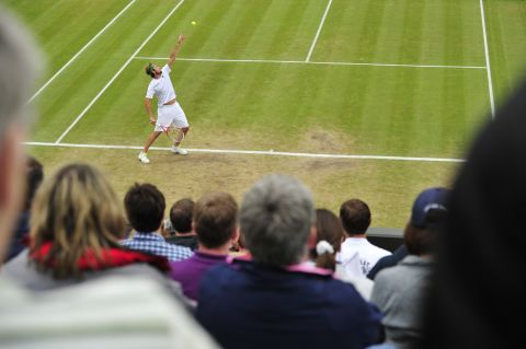 Mardy Fish of the United States serves to France's Jo-Wilfried Tsonga on Tuesday.