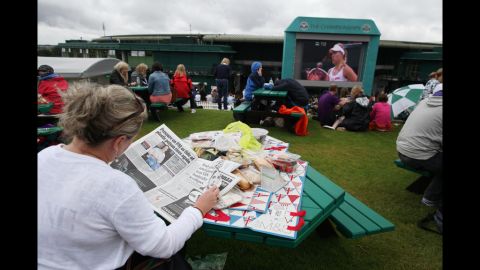 The crowd on Murray Mount watches the action or finds other entertainment on Day Nine of Wimbledon.
