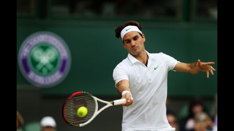 Roger Federer of Switzerland hits a forehand return during his men's singles quarterfinal match against Mikhail Youzhny of Russia on Wednesday.