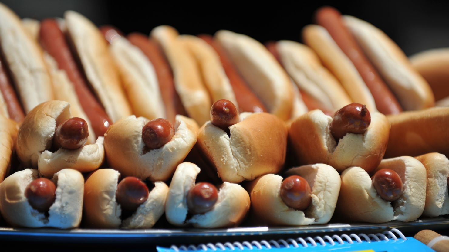 A pile of hot dogs sits on a table at the official weigh-in ceremony for Nathan's hot dog contest on Tuesday.