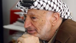 A file handout picture dated April 21, 2004 and made available by the Palestinian Press Office (PPO) shows Palestinian leader Yasser Arafat at his office in the West Bank city of Ramallah.