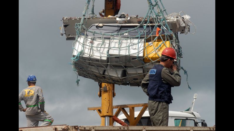 Additional debris is unloaded at the Port of Recife on June 19, 2009. 