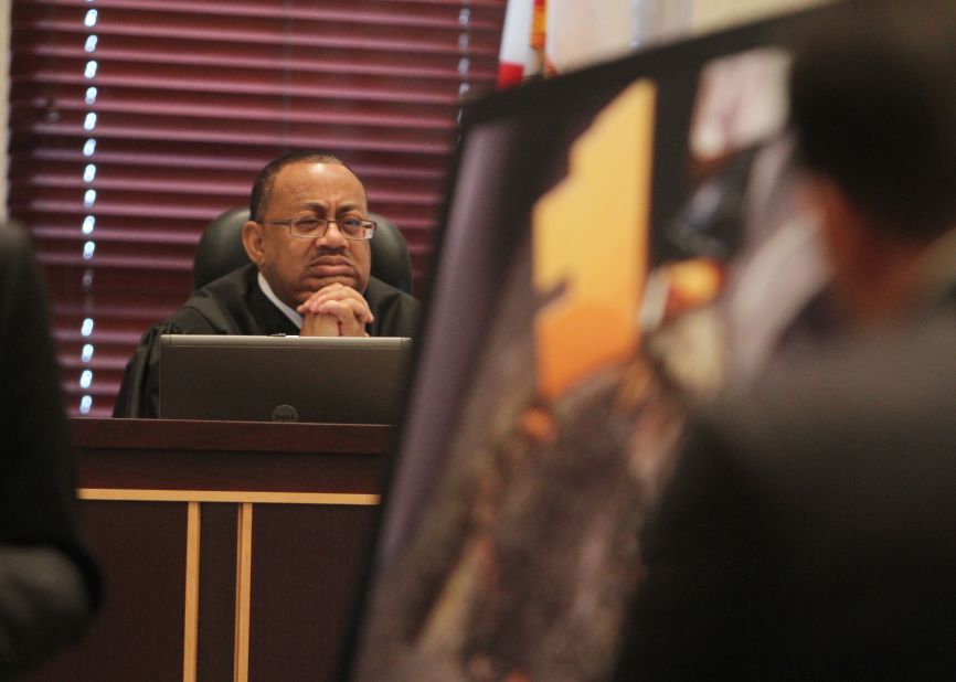 <strong>June 2011: </strong>Judge Belvin Perry looks at evidence as it's presented during the trial.