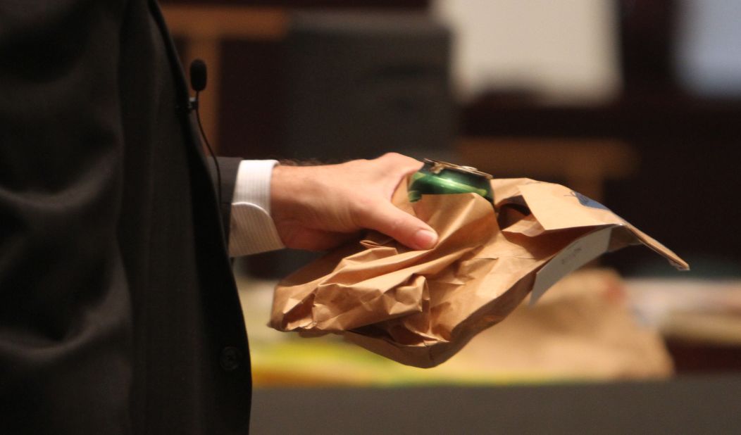 <strong>June 2011: </strong>Assistant State Attorney Jeff Ashton holds crime scene evidence during a cross-examination of entomologist Dr. Tim Huntington. The country's interest in every update on the case was voracious; by the time it concluded, it had <a href="https://mediadecoder.blogs.nytimes.com/2011/07/06/casey-anthony-verdict-brings-hln-record-ratings/" target="_blank" target="_blank">yielded record ratings for some networks.</a> 