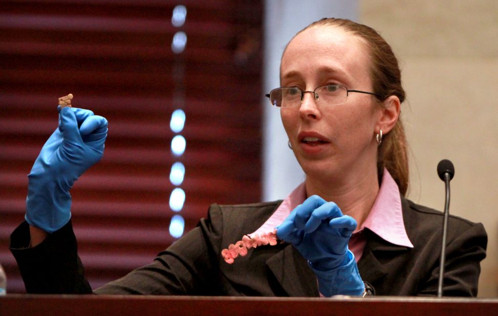 <strong>June 2011: </strong>Jennifer Welch, a crime scene investigator with the Orange County Sheriff's Office, shows letters from Caylee's T-shirt that were entered into evidence.