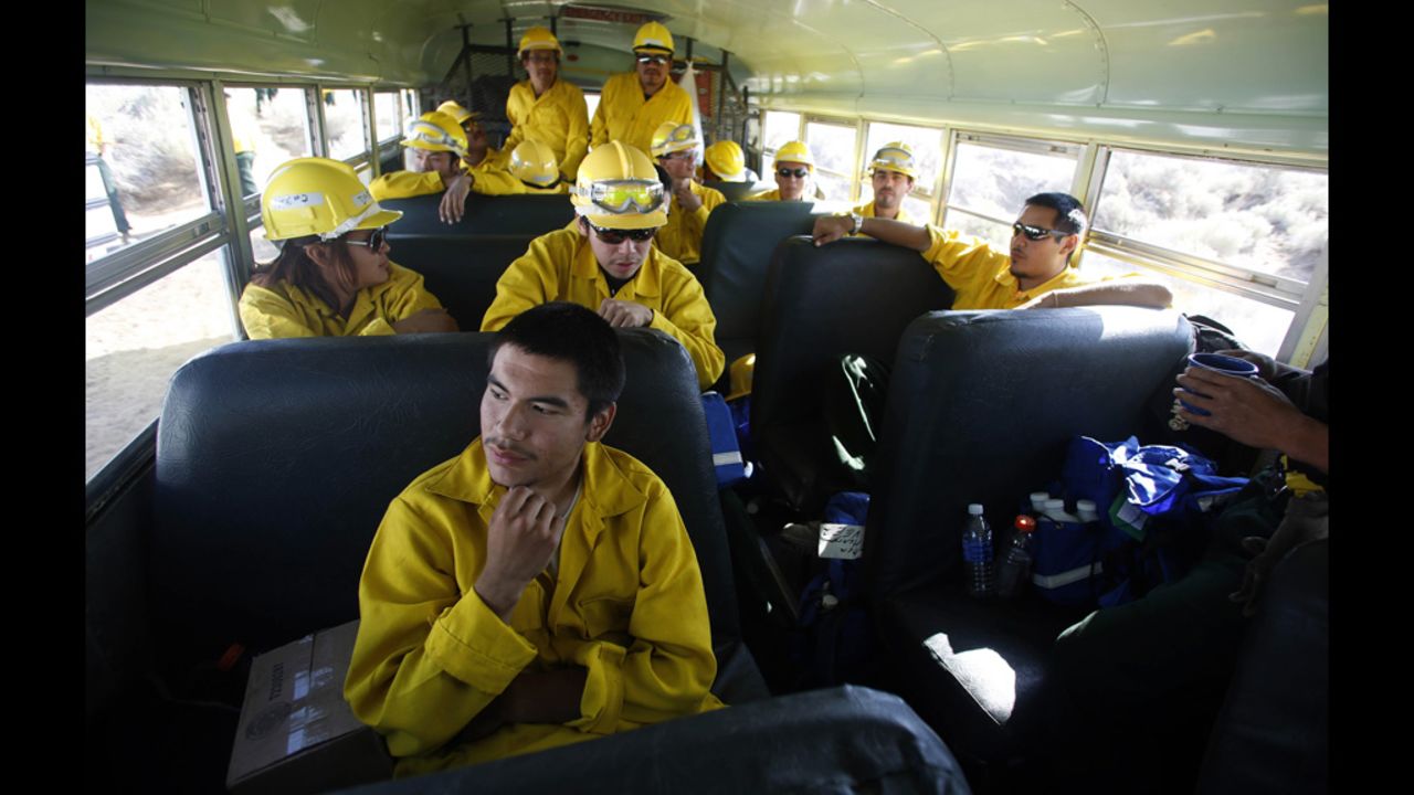 Firefighter Ryan Christian sits with his crew from Alaska before heading out to fight the Fontenelle Fire outside Big Piney. The blaze, burning in dead and thick stands of timber, started on June 24 and is  15% contained. 