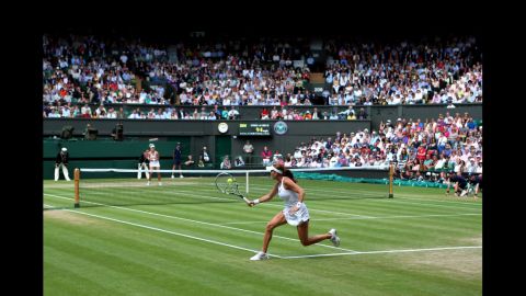Radwanska returns a shot during her Ladies' Singles semifinal match against Kerber.