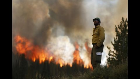 Firefighter Alex Abols monitors fire on the north flank of the Fontenelle Fire outside Big Piney. Record fire danger and long stretches of the red flag warning days have made it challenging to control.