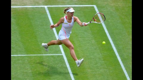 Kerber returns a shot during her Ladies' Singles semifinal match against Radwanska.