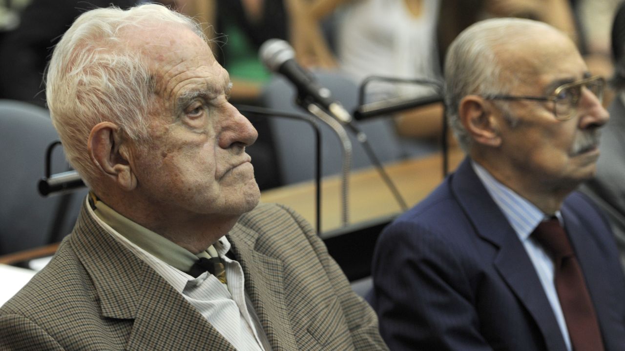 Former Argentine general and last dictator Reynaldo Bignone, left, and former Argentine general and dictator Jorge Rafael Videla attend the beginning of their trial on February 28, 2011. 