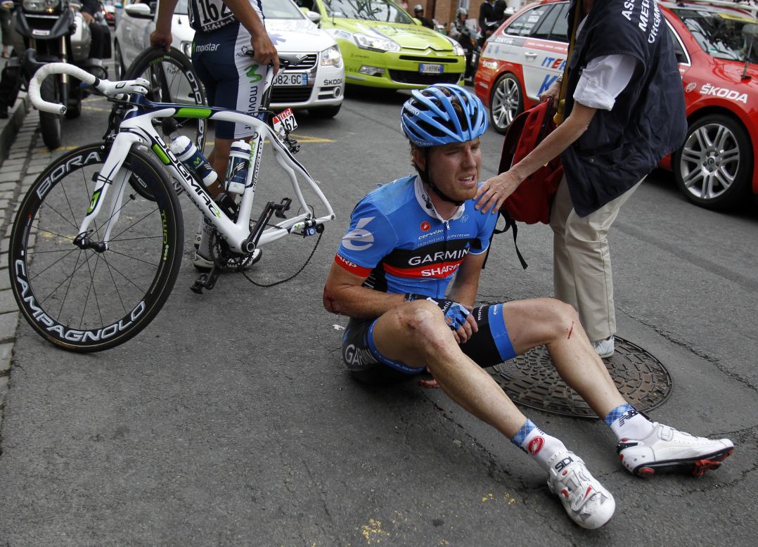 Tyler Farrar of USA riding for Garmin-Sharp sits on the ground dazed after crashing hard near the end of Thursday's stage.