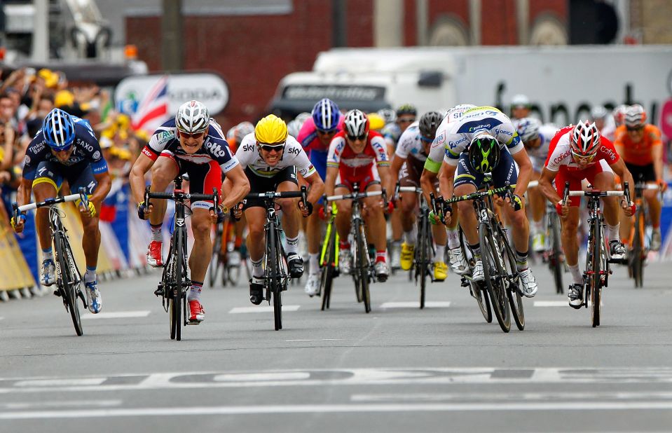 Andre Greipel, second from left, of the Lotto-Belisol team charges ahead to the finish line on Thursday to win Stage 5 of the Tour de France. 