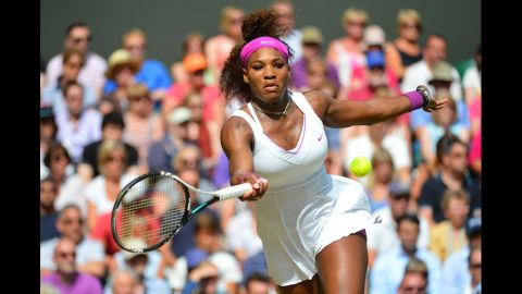 Serena Williams takes a forehand shot during her women's singles semifinal match against Belarus' Victoria Azarenka on day 10 of Wimbledon.