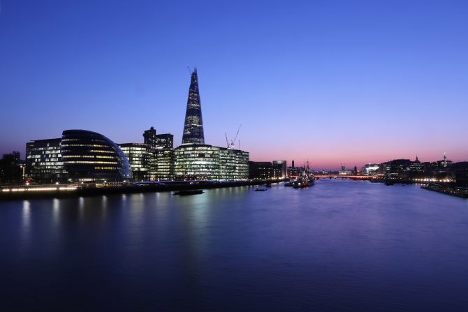 The view of the River Thames looking west from Tower Bridge including the Shard, City Hall and HMS Belfast at night on March 28, 2012 in London.