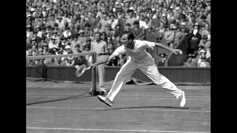 Perry (1909-1995) stretches to return a shot during his semifinal match against Don Budge of the United States at the Wimbledon Lawn Tennis Championships. 