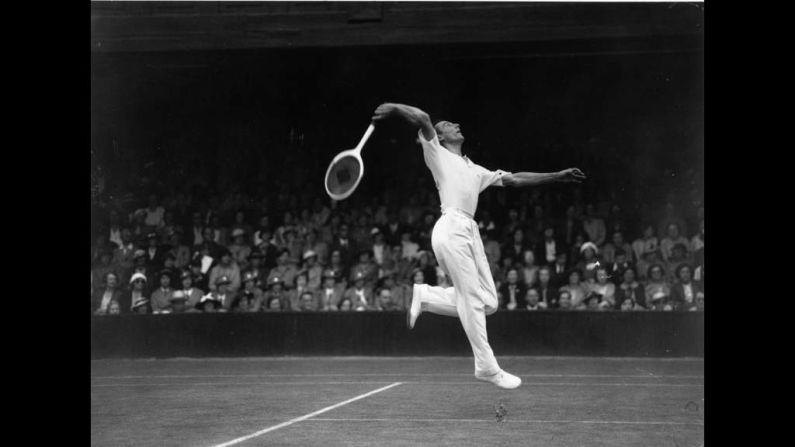 Perry returns a serve against U.S. player Bryan Grant in Court Number One at Wimbledon on June 29, 1936.