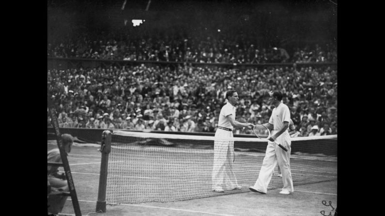 Von Cramm shakes hands with Perry after Perry's victory in the men's singles final on the center court at the Wimbledon on July 3, 1936. Perry defeated the German player in straight sets.
