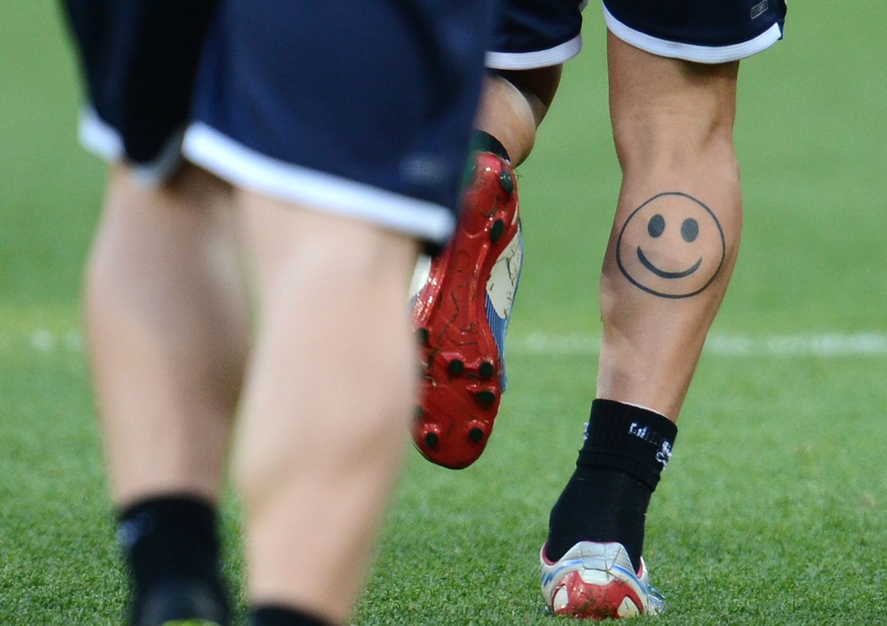 An Italian player flashes a smiley face tattoo during a training session in June 2012 before the finals of the Euro 2012 football championships.