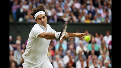 Roger Federer hits a forehand return during his Gentlemen's Singles semifinal match against Novak Djokovic on Friday.