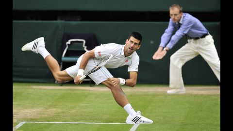 Novak Djokovic reacts during his men's singles semifinal match Friday against Roger Federer.