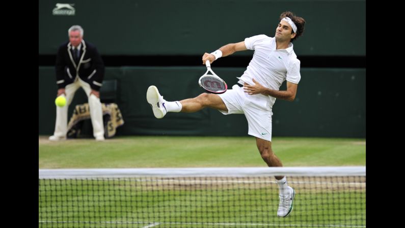 Roger Federer plays a shot during his men's singles semifinal match against Novak Djokovic.