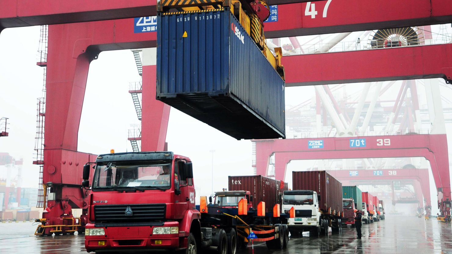 Containers been loaded on to a ship at the Qingdao port, in northeastern China's Shandong province on March 9, 2012. 
