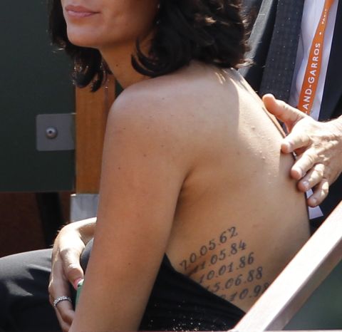 Belgian model Jade Foret shows off tattoos during a French Open tennis match.