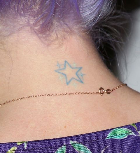 Kelly Osbourne, who has said she regrets getting some of her tattoos, shows a star on her neck.