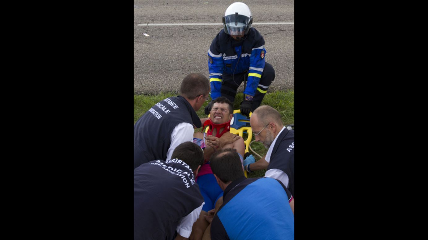 Italy's Davide Vigano is lifted on a stretcher after the crash on Friday, July 6.