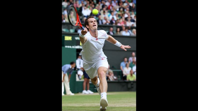 Murray hits a forehand return against Tsonga.