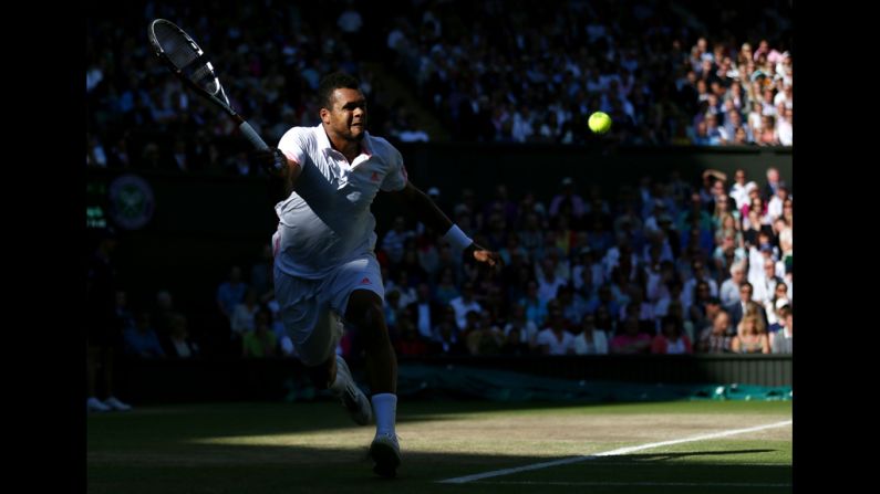 Tsonga hits a forehand return.