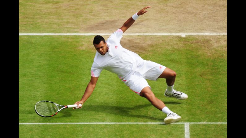 Tsonga slips trying to change directions on a return shot.