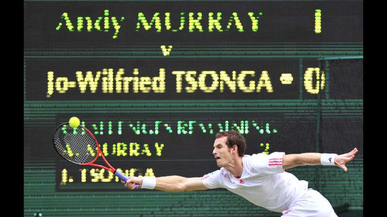 Murray stretches to make a forehand return against Tsonga.