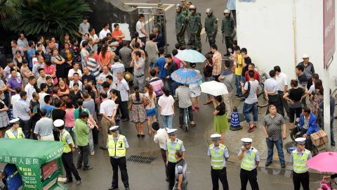 Police guard government offices in Shifang after authorities bowed to violent protests against a chemical plant.