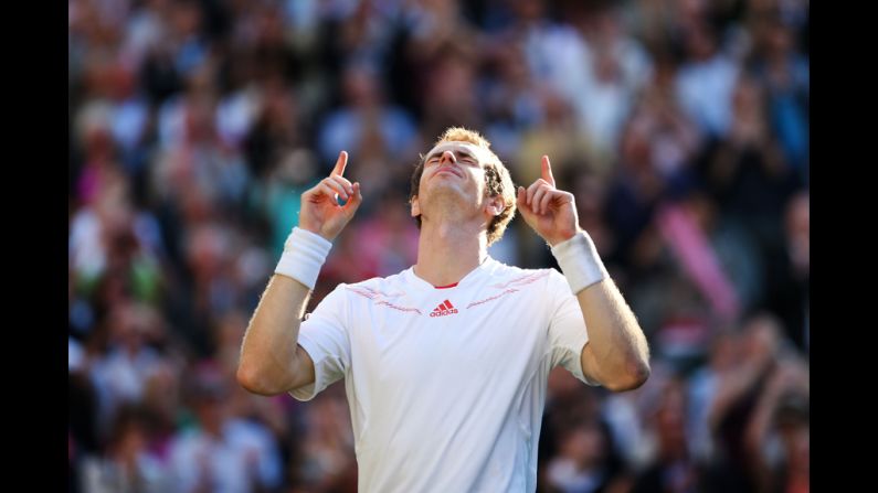 Andy Murray of Great Britain celebrates the winning point during his men's singles semifinal match against Jo-Wilfried Tsonga of France at Wimbledon on Friday. He is the first British player to move past this leg of the tournament in 74 years. To view Britain's last Wimbledon champ, <a href="index.php?page=&url=http%3A%2F%2Fwww.cnn.com%2F2012%2F07%2F06%2Fworld%2Fgallery%2Ffred-perry-wimbledon%2Findex.html">click here</a>.