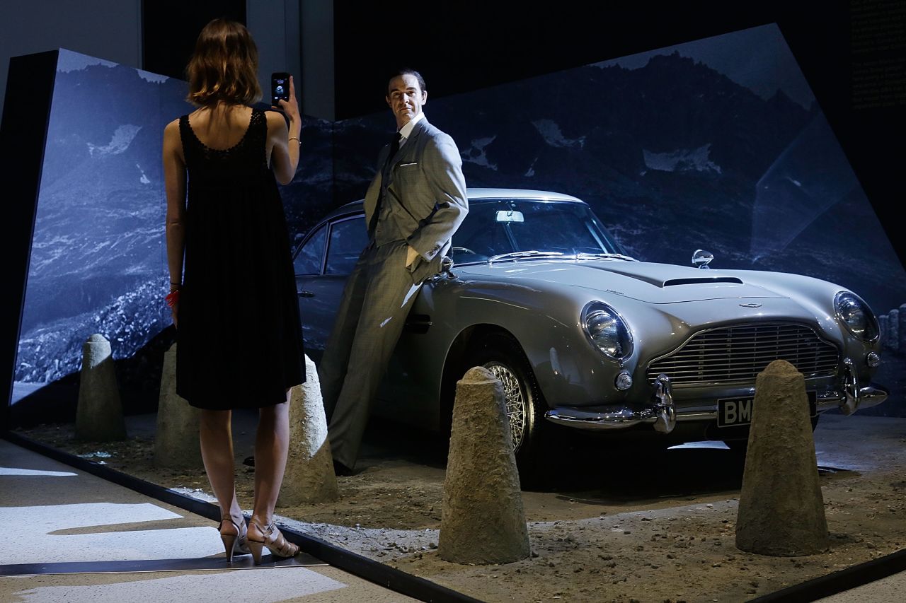  A Sean Connery waxwork and the famous Aston Martin DB5 greets fans outside the exhibition.