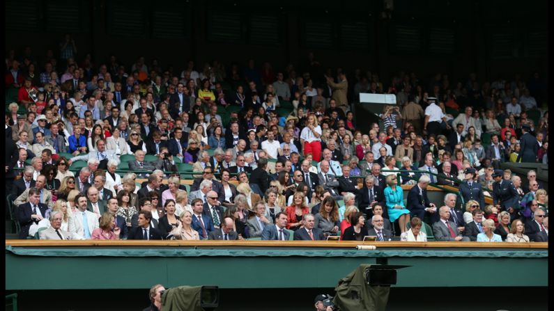 Spectators in the royal box on Centre Court wait for the final match to begin on Saturday.