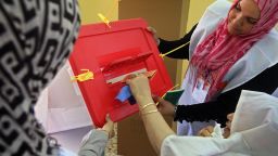 A Libyan woman casts her ballot at a school turned polling station in the western city of Misrata on July 7.
