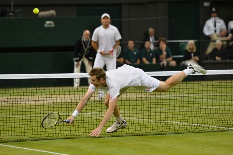 Jonathan Marray of Great Britain reaches for a shot during his men's doubles final victory.