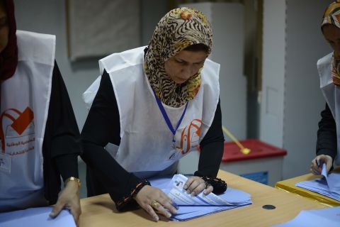 Libyan election workers start the ballot-counting process at a Tripoli polling station during Libya's General National Assembly.