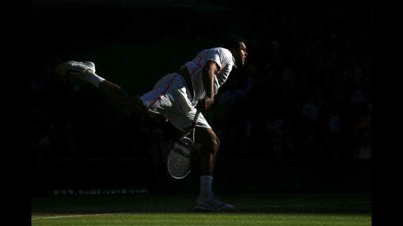 France's Jo-Wilfried Tsonga serves the ball during his Gentlemen's Singles semifinal match against Andy Murray of Great Britain.